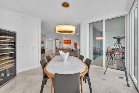a view of a living room and floor to ceiling window