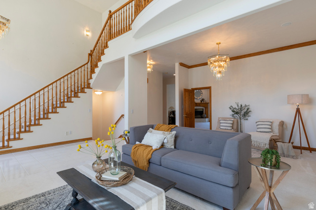 1085 Windsor Drive Provo, UT 84604 - Photo 14 of 83 Living room with a chandelier, stairs, and a high ceiling