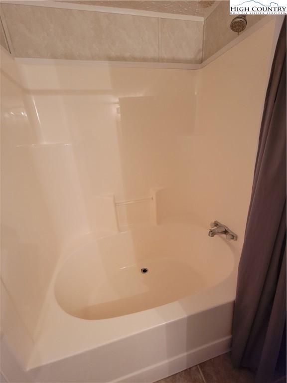 2316 Longhope Road Boone, NC 28607 - Photo 11 of 13 a bathroom with a bathtub