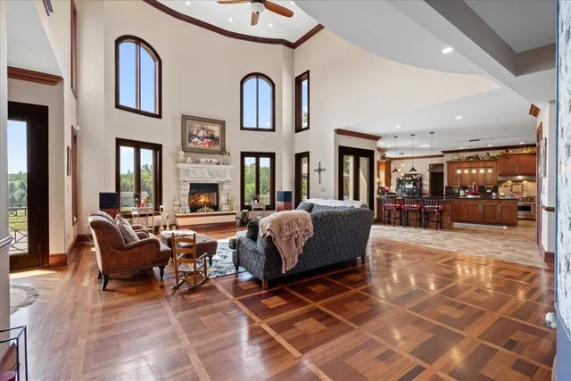 a kitchen with stainless steel appliances granite countertop a sink counter space cabinets and a large window