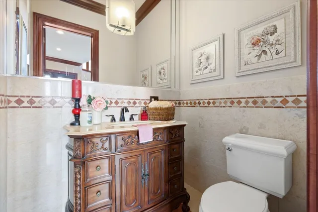 a view of a living room with furniture and wooden floor