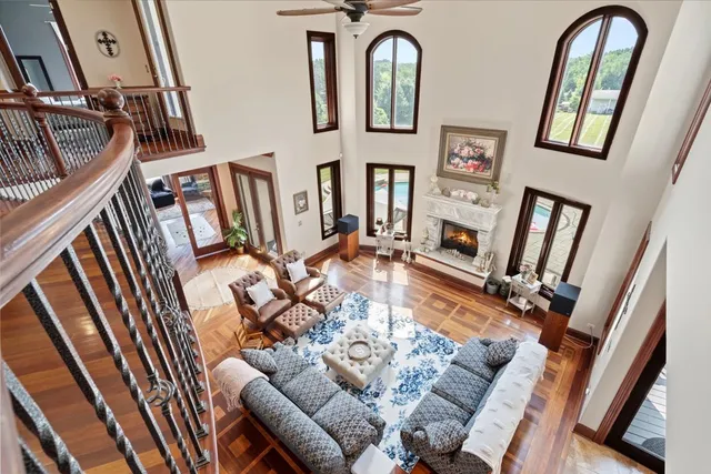 a view of a balcony with chair and wooden floor