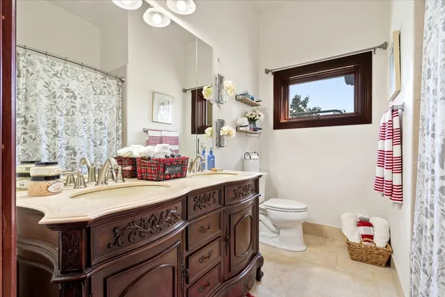 a view of a house with swimming pool and sitting area