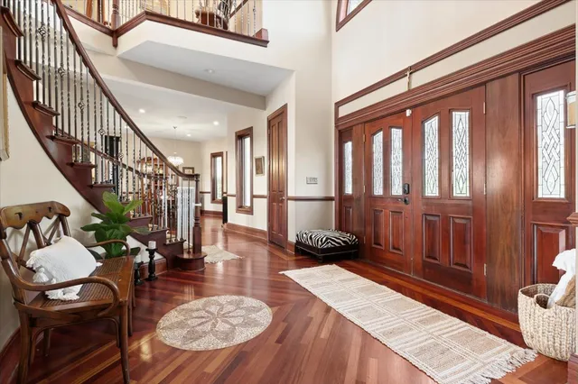 a living room with fireplace furniture and a large window