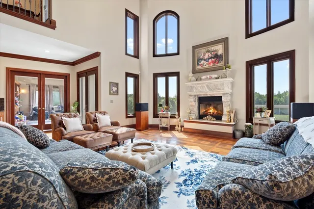 a large kitchen with stainless steel appliances granite countertop a stove and cabinets