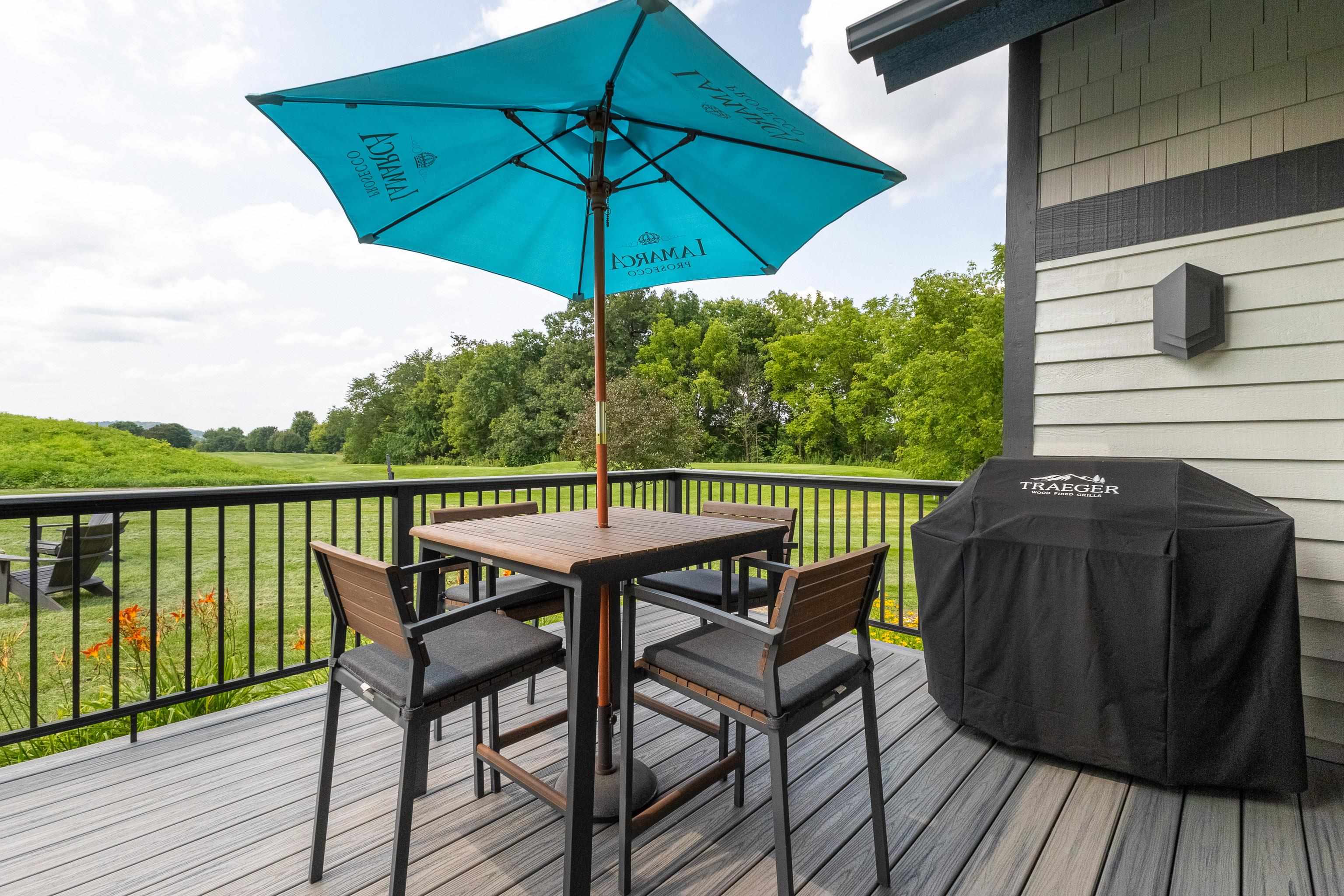 6 Hickory Trail Galena, IL 61036 - Photo 21 of 67 a view of a balcony with furniture and umbrella