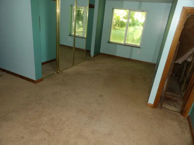 an empty room with windows