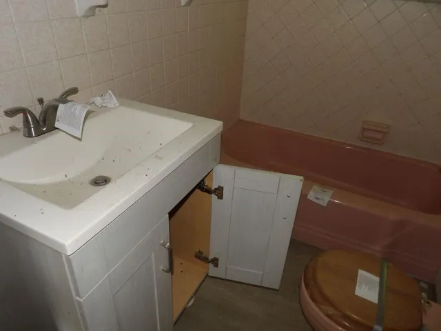 a bathroom with a sink and toilet