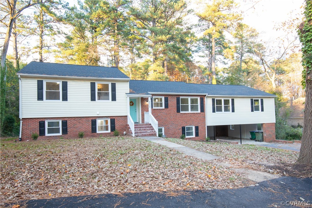 8530 Cherokee Road Richmond, VA 23235 - Photo 1 of 40 a front view of a house with a yard