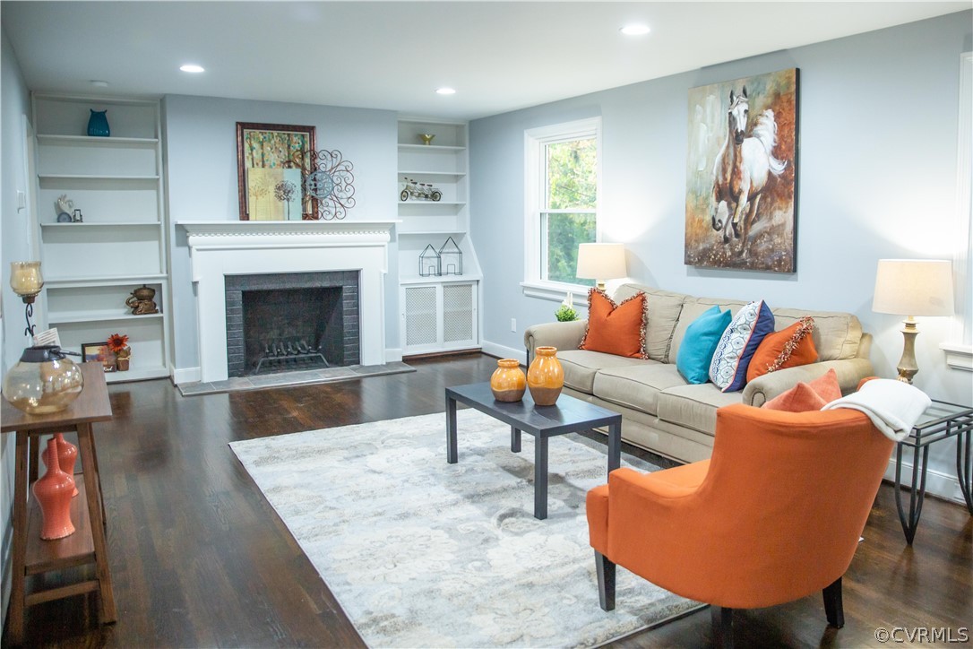 8530 Cherokee Road Richmond, VA 23235 - Photo 11 of 40 a living room with furniture and a fireplace