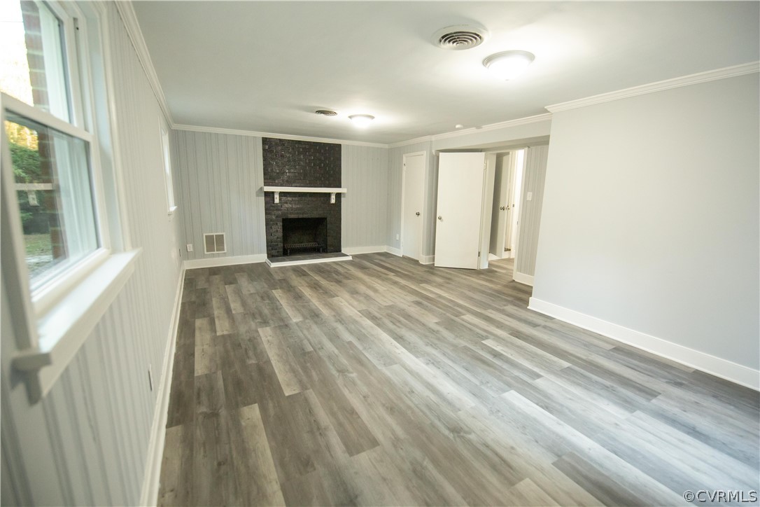 8530 Cherokee Road Richmond, VA 23235 - Photo 29 of 40 a view of an empty room with a fireplace and a window