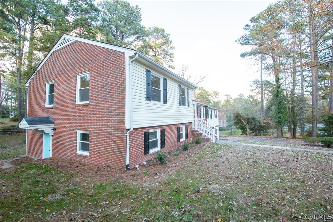 8530 Cherokee Road Richmond, VA 23235 - Photo 39 of 40 a front view of a house with a yard