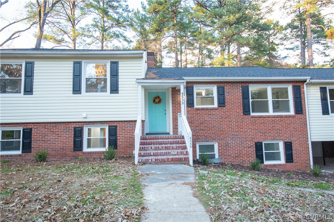 8530 Cherokee Road Richmond, VA 23235 - Photo 40 of 40 a front view of a house with garden