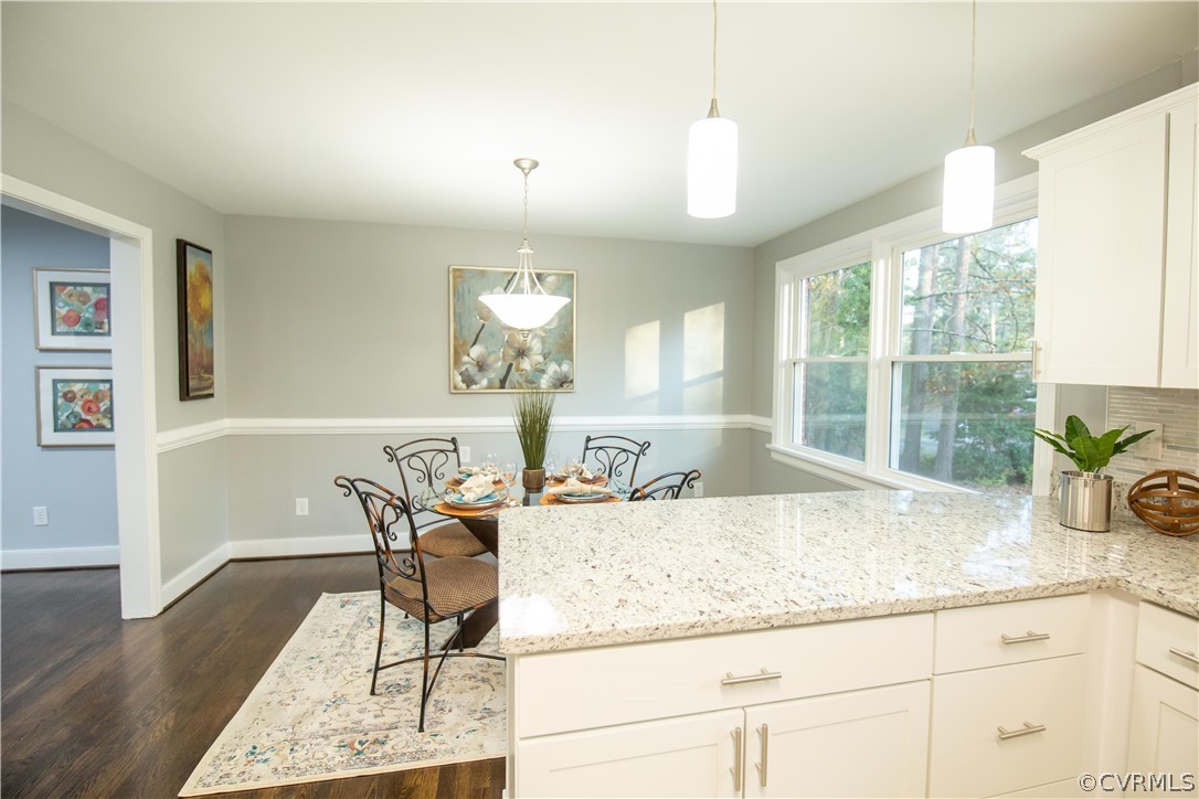 8530 Cherokee Road Richmond, VA 23235 - Photo 4 of 40 a kitchen with granite countertop sink and cabinets