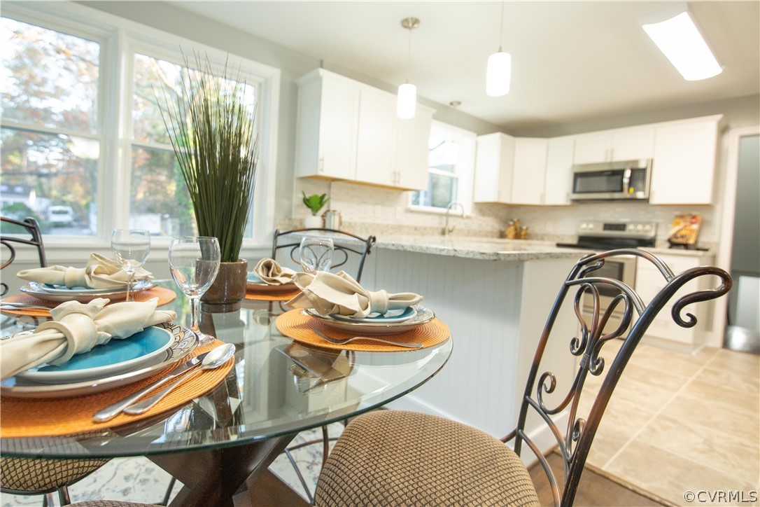 8530 Cherokee Road Richmond, VA 23235 - Photo 7 of 40 a very nice looking dining room with a table and chairs