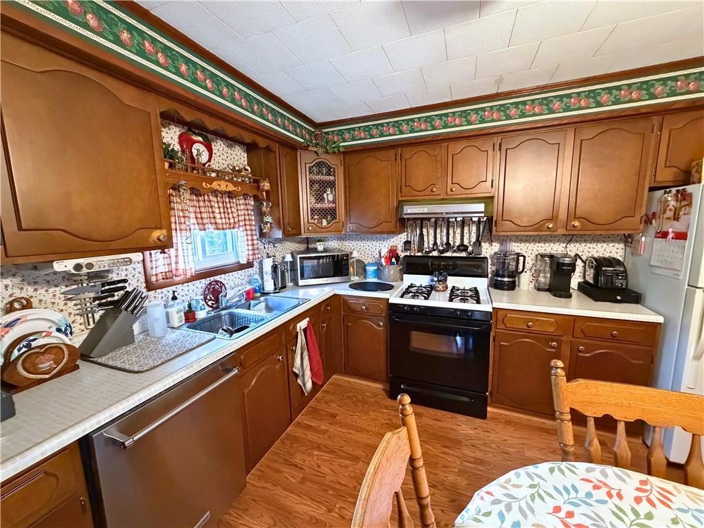 1648 Butler Pike Mercer, PA 16137 - Photo 11 of 25 a kitchen with a refrigerator stove and sink