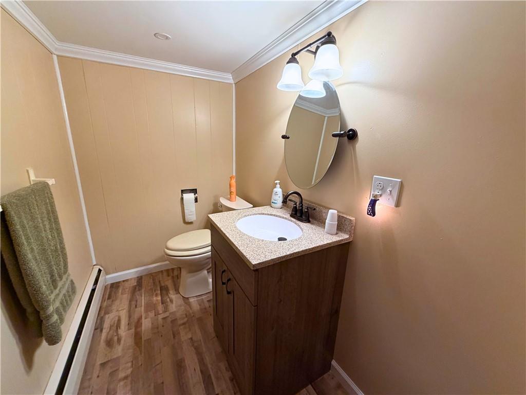 1648 Butler Pike Mercer, PA 16137 - Photo 18 of 25 a bathroom with a sink a toilet and mirror