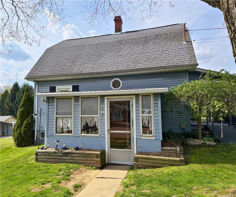 1648 Butler Pike Mercer, PA 16137 - Photo 2 of 25 a front view of a house with a yard
