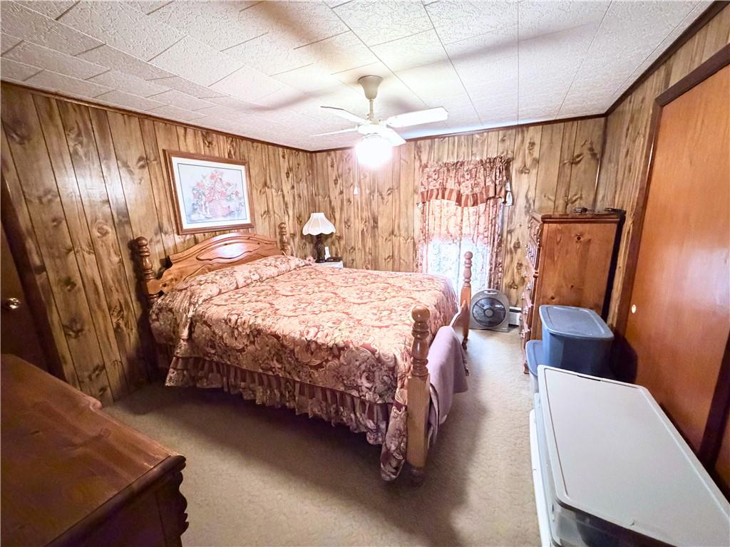 1648 Butler Pike Mercer, PA 16137 - Photo 23 of 25 a bedroom with a bed couch and a window