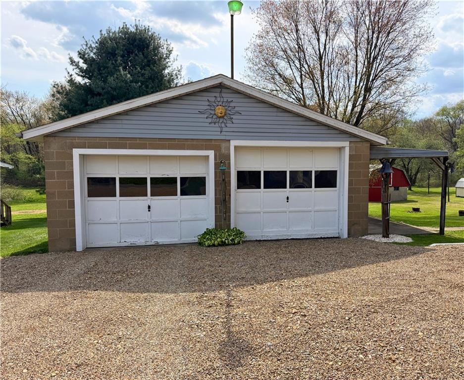 1648 Butler Pike Mercer, PA 16137 - Photo 6 of 25 a front view of a house with a yard and garage