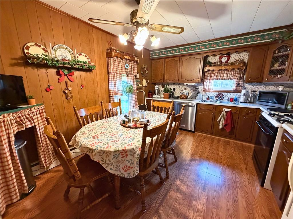 1648 Butler Pike Mercer, PA 16137 - Photo 9 of 25 a view of a dining room with furniture window and wooden floor