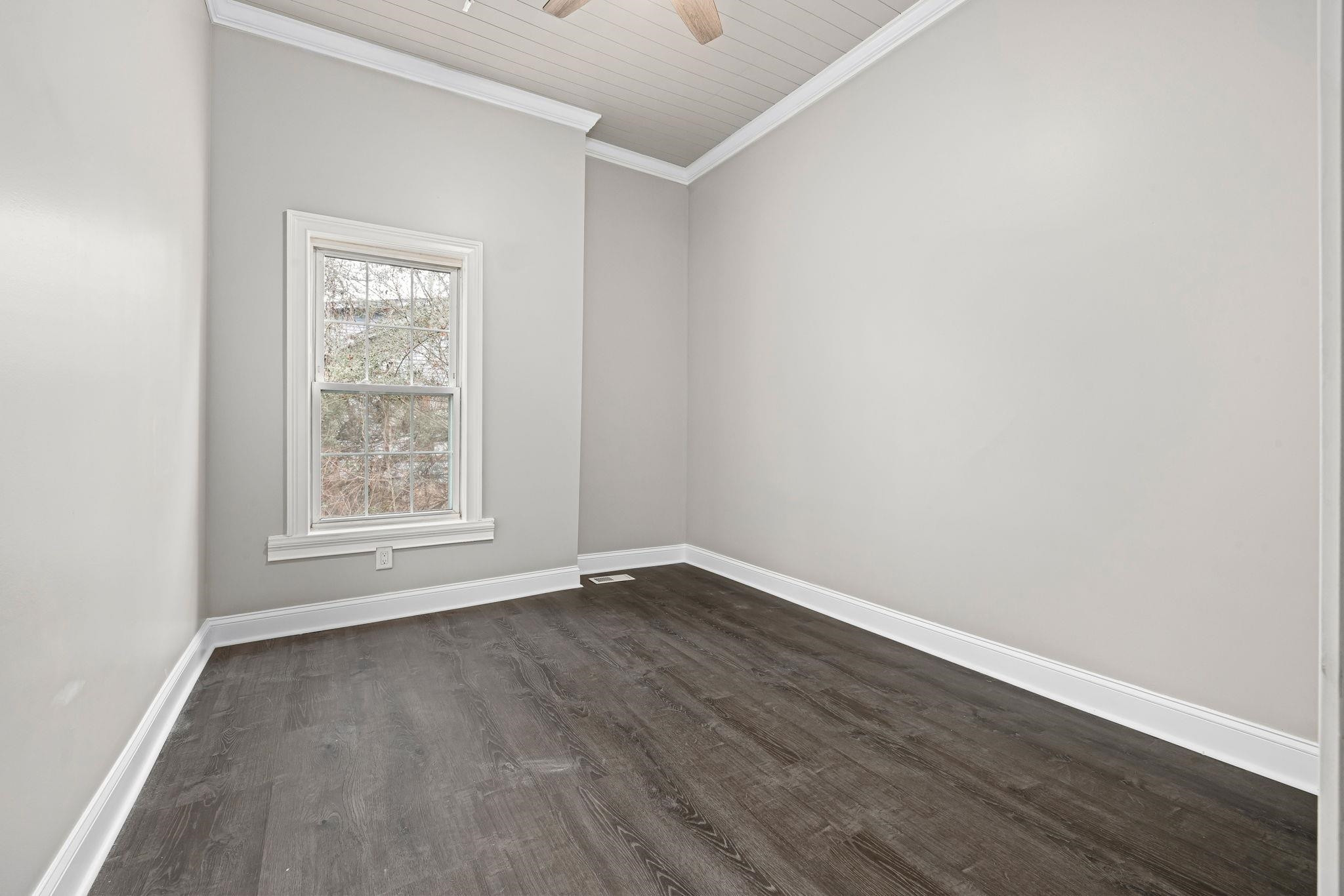 1716 Chapel Hill Road Durham, NC 27707 - Photo 11 of 33 an empty room with wooden floor and windows