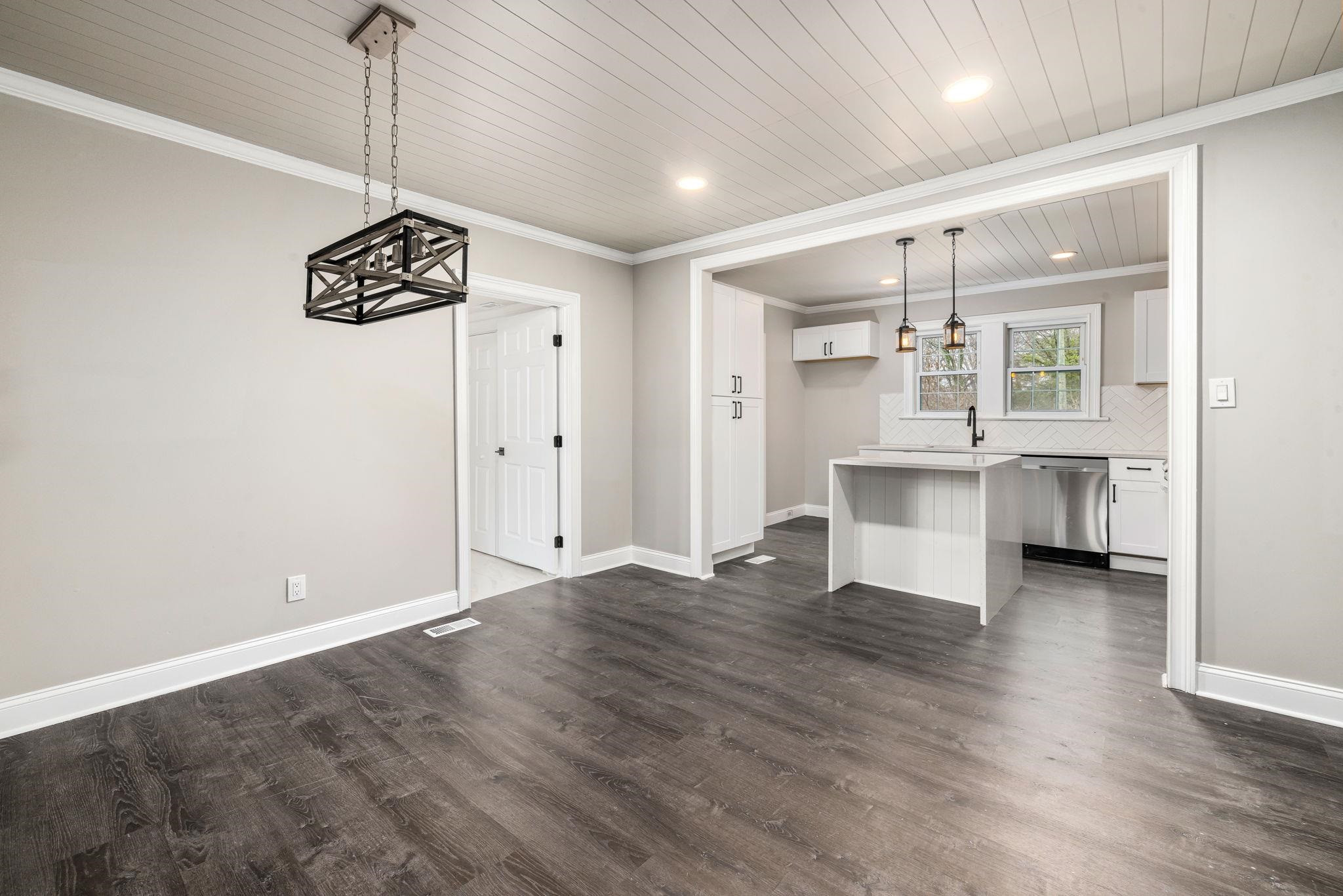 1716 Chapel Hill Road Durham, NC 27707 - Photo 13 of 33 a view of an empty room with a window and kitchen view