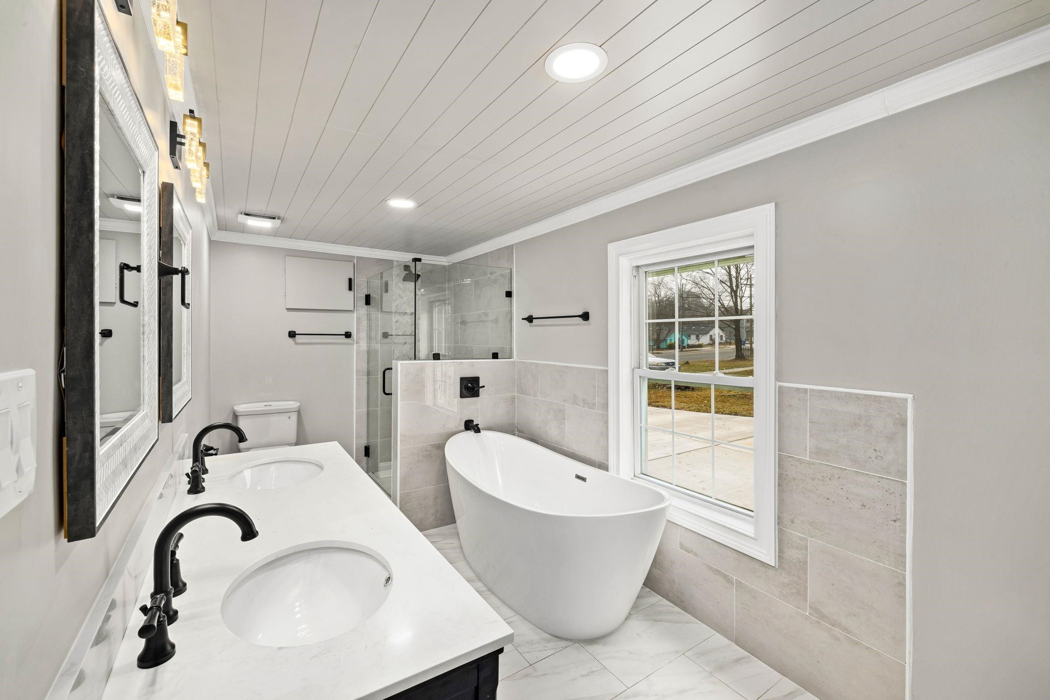 1716 Chapel Hill Road Durham, NC 27707 - Photo 18 of 33 a bathroom with a tub sink toilet and mirror