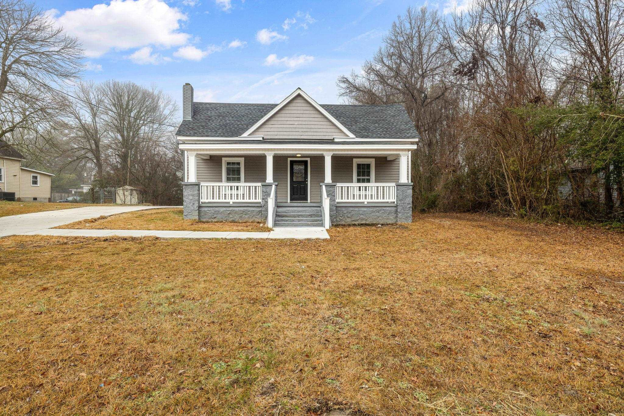 1716 Chapel Hill Road Durham, NC 27707 - Photo 2 of 33 a front view of a house with a yard