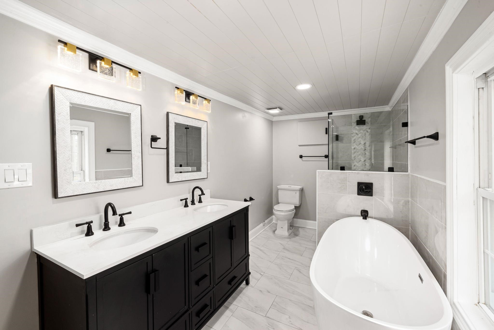 1716 Chapel Hill Road Durham, NC 27707 - Photo 21 of 33 a bathroom with a sink a toilet and mirror