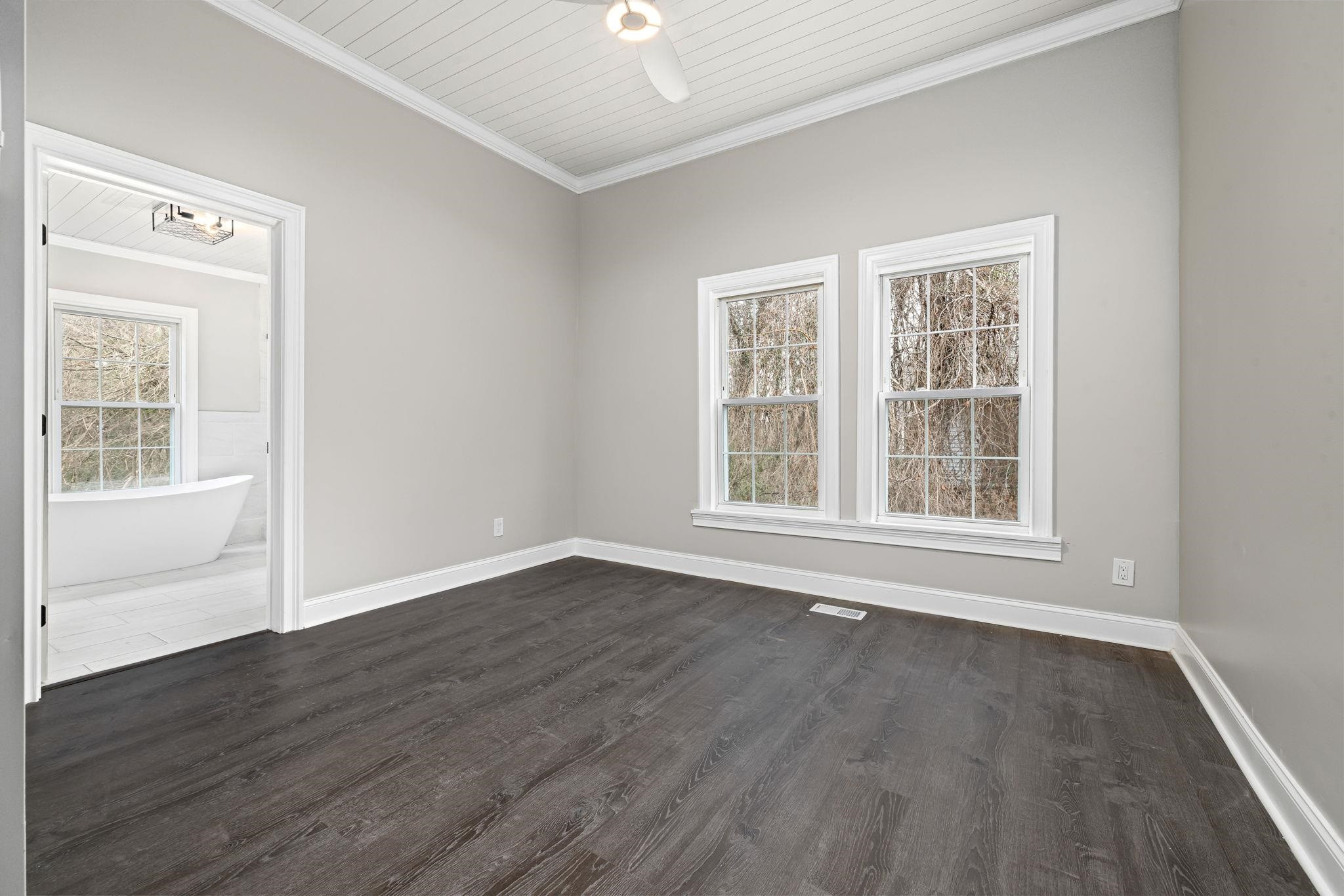 1716 Chapel Hill Road Durham, NC 27707 - Photo 22 of 33 a view of an empty room with wooden floor and a window