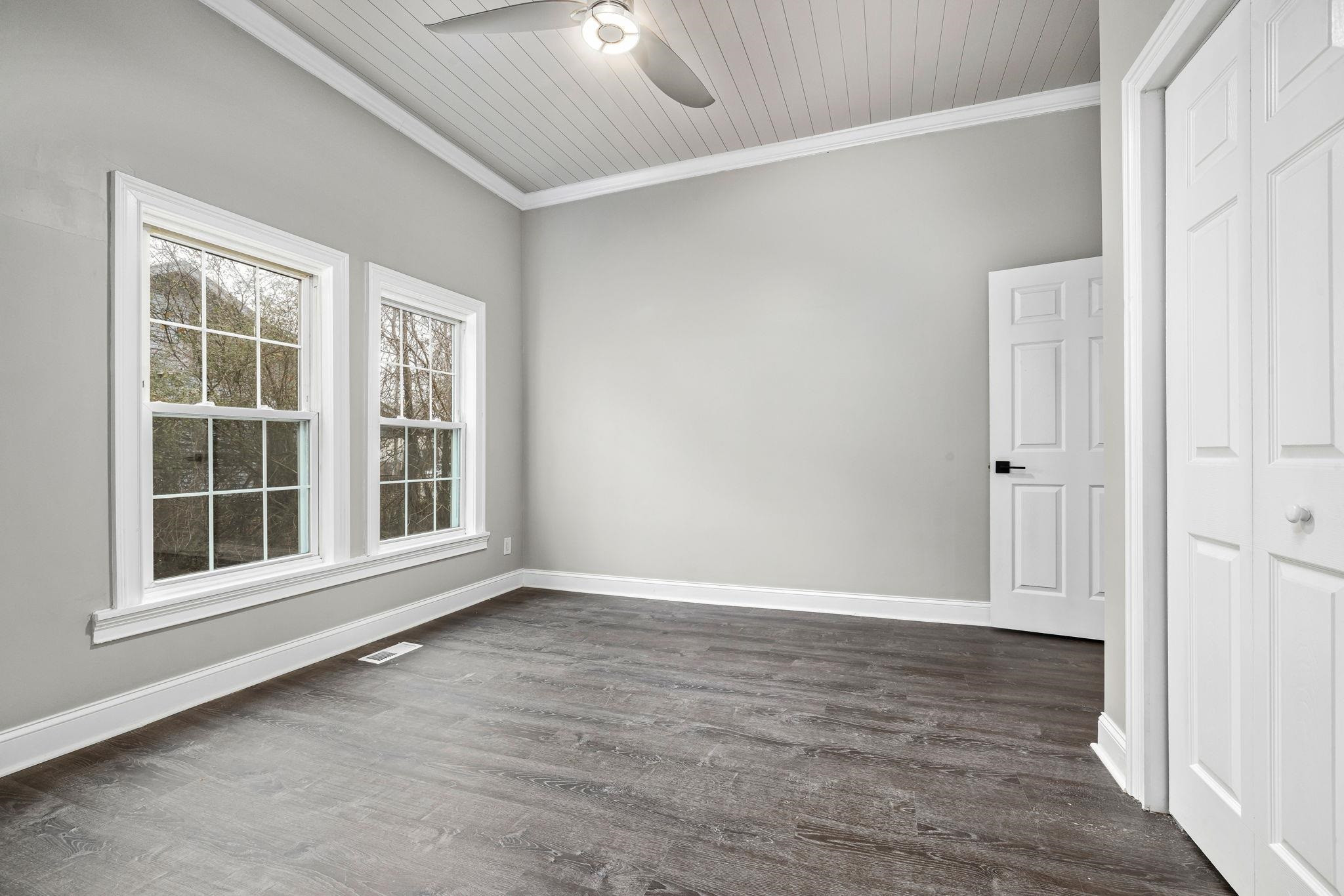 1716 Chapel Hill Road Durham, NC 27707 - Photo 24 of 33 an empty room with wooden floor and windows
