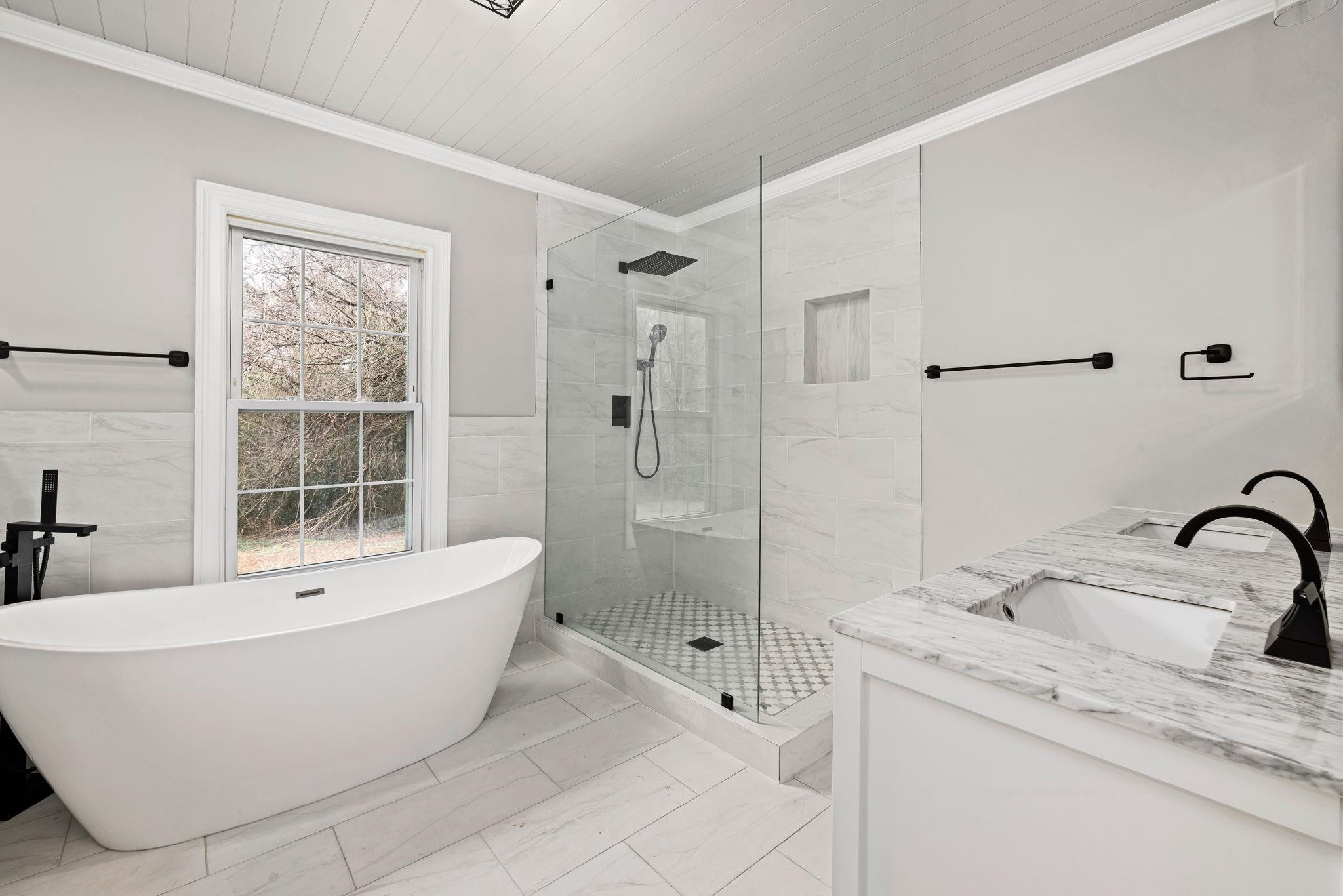 1716 Chapel Hill Road Durham, NC 27707 - Photo 25 of 33 a bathroom with a bathtub and shower