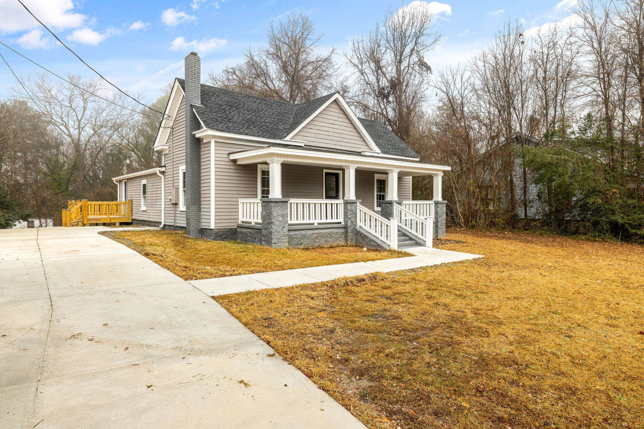 1716 Chapel Hill Road Durham, NC 27707 - Photo 3 of 33 a front view of a house with a yard