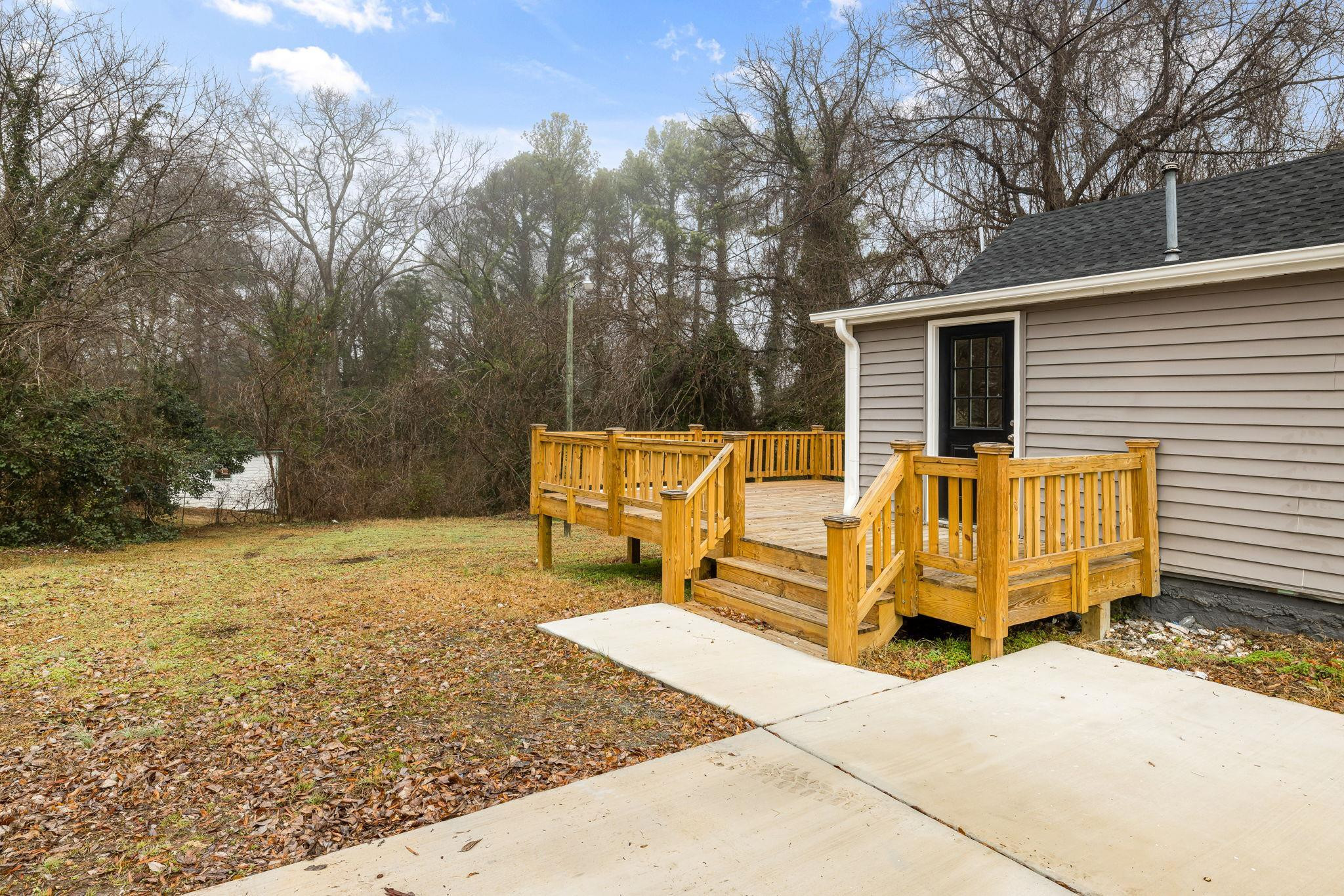1716 Chapel Hill Road Durham, NC 27707 - Photo 31 of 33 a view of a patio with table and chairs with wooden fence and plants