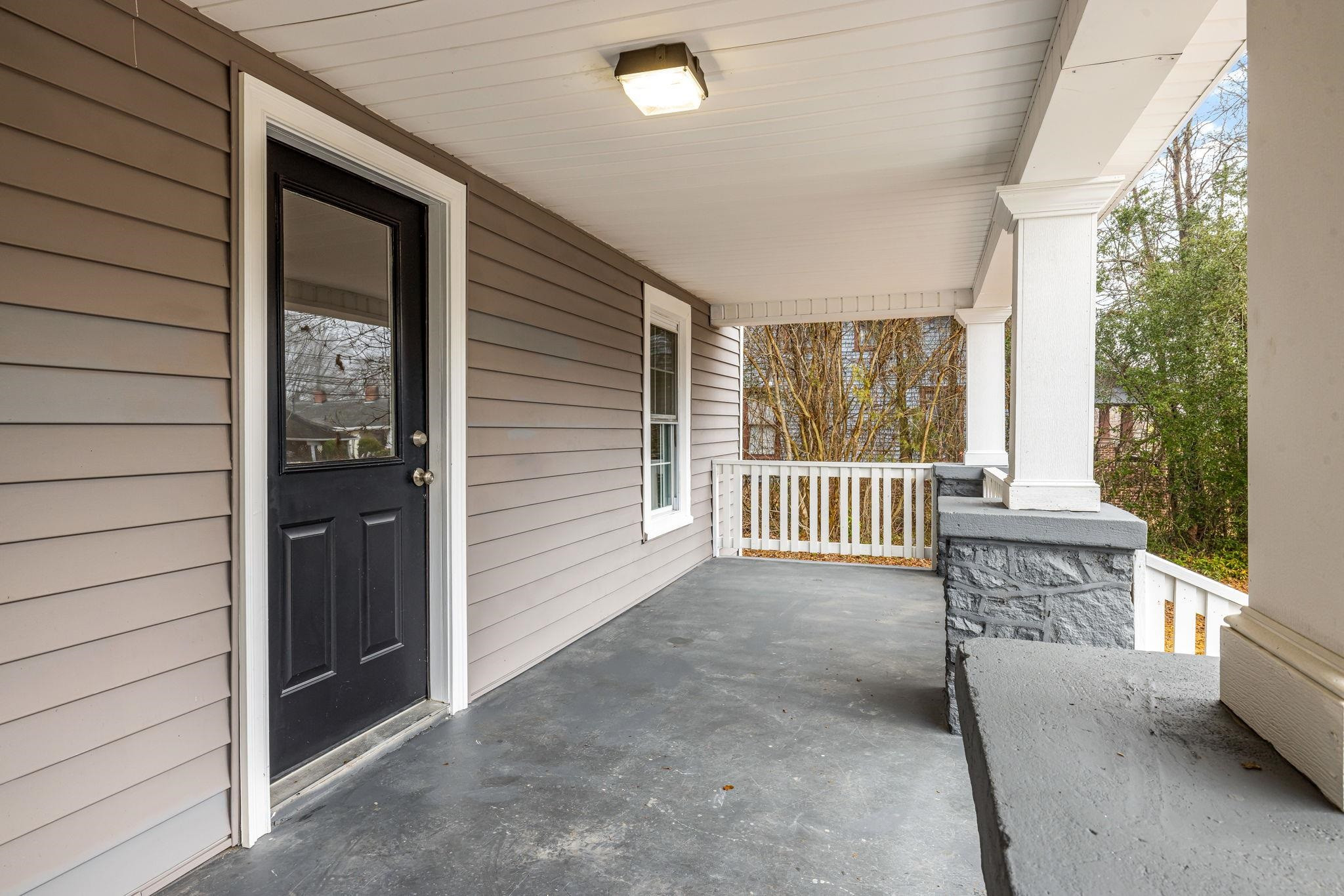 1716 Chapel Hill Road Durham, NC 27707 - Photo 5 of 33 a view of a porch with wooden floor and outdoor space