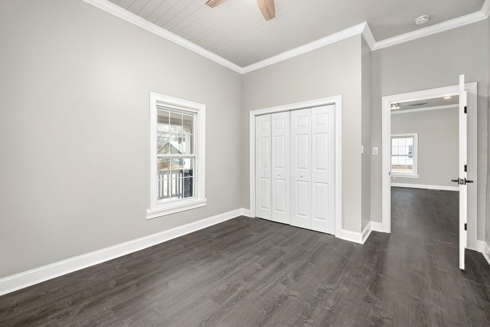 1716 Chapel Hill Road Durham, NC 27707 - Photo 9 of 33 an empty room with wooden floor and windows