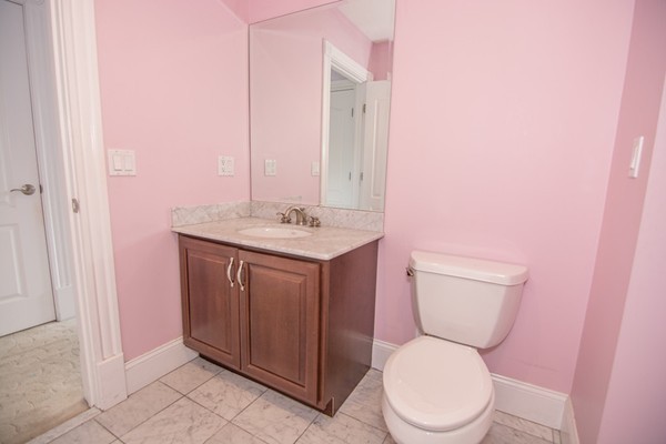 68 Coppermine Road Topsfield, MA 01983 - Photo 13 of 30 a white toilet sitting next to a bathroom sink