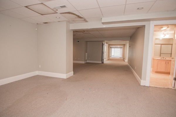 68 Coppermine Road Topsfield, MA 01983 - Photo 8 of 30 a view of a big room with windows and chandelier