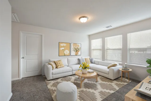 an open kitchen with kitchen island a refrigerator and a stove