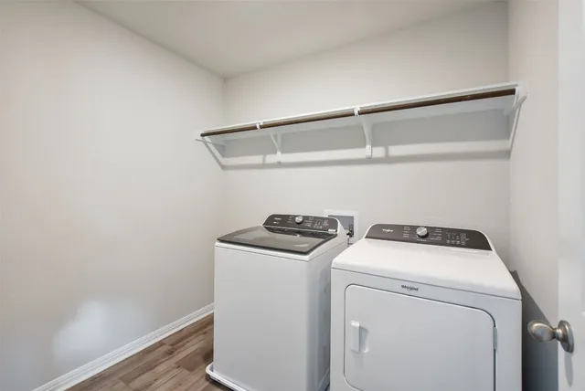 an empty room with windows & closet in a room