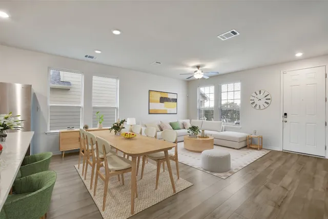 a view of a kitchen with a sink and a refrigerator