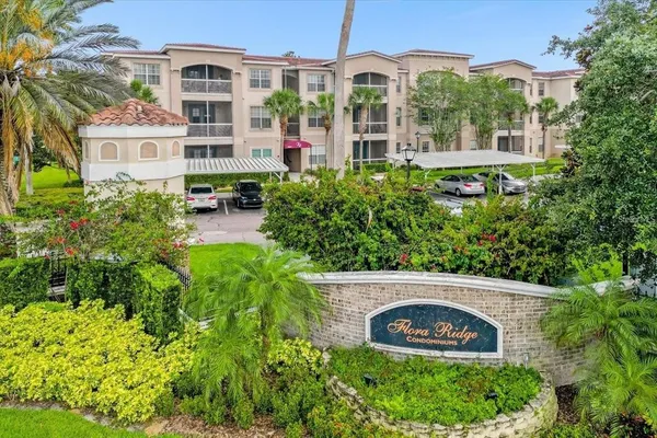 a view of multi story residential apartment building with a yard