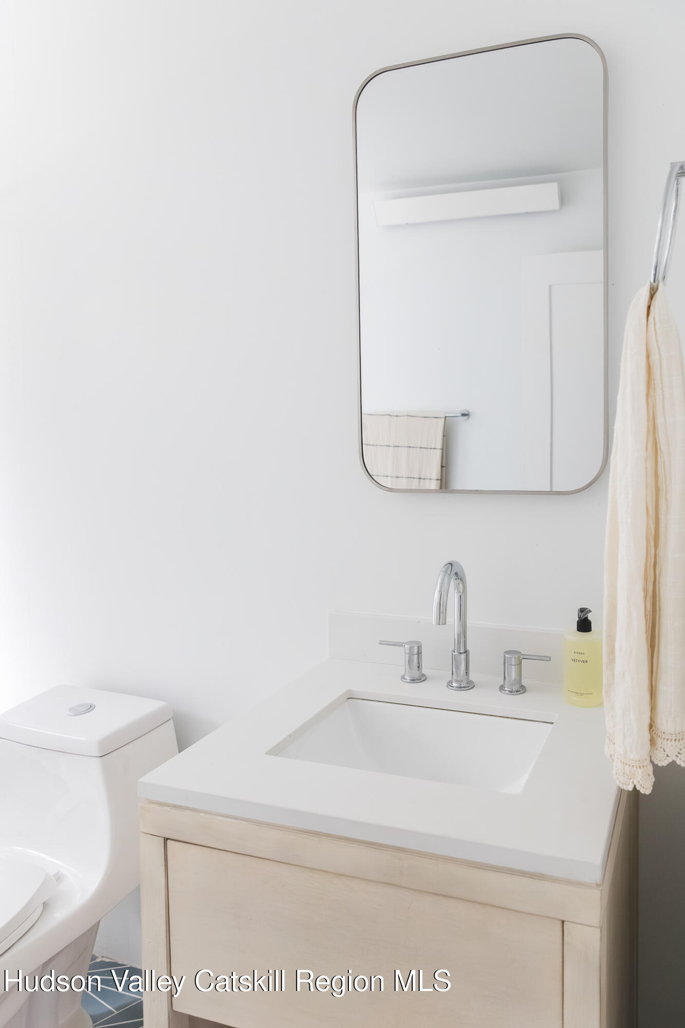 546 Willowemoc Road Livingston Manor, NY 12758 - Photo 19 of 30 a bathroom with a sink a toilet and mirror