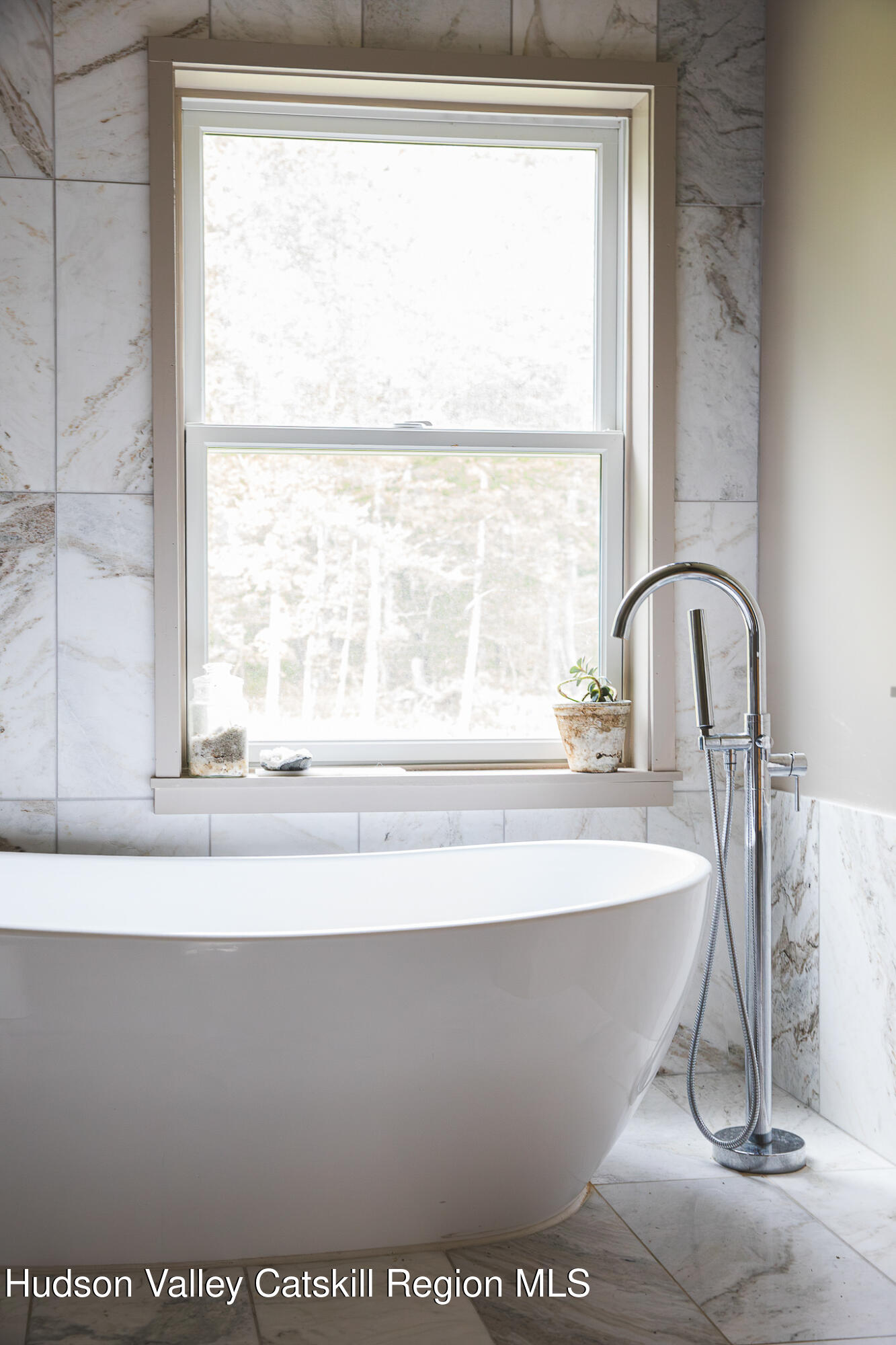546 Willowemoc Road Livingston Manor, NY 12758 - Photo 23 of 30 a white bath tub sitting next to a window