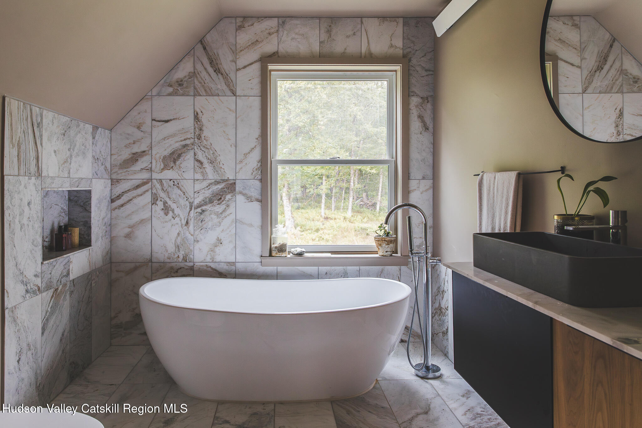 546 Willowemoc Road Livingston Manor, NY 12758 - Photo 24 of 30 a bath tub sitting in a bathroom next to a window