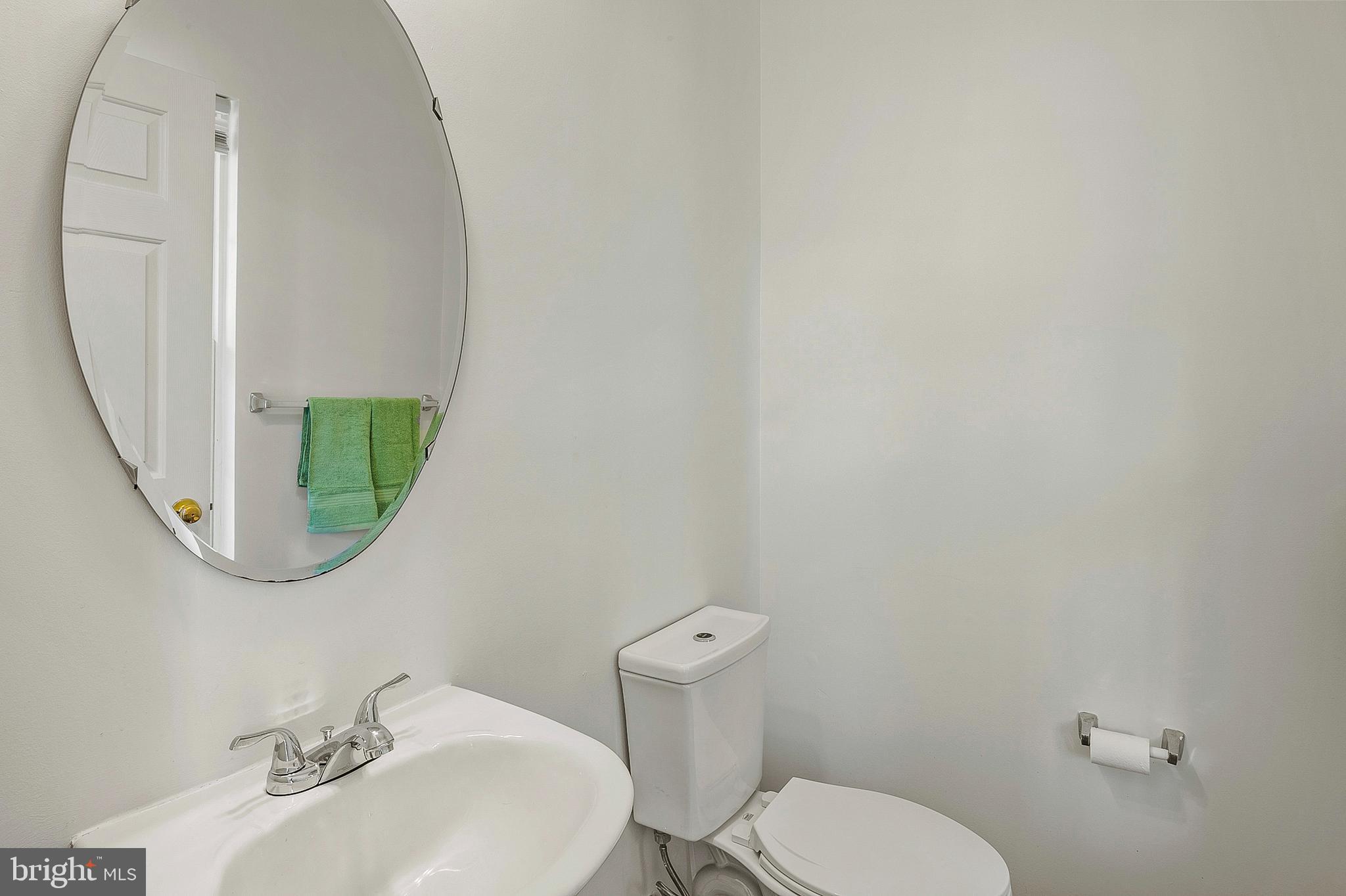 456 North Patuxent Road Odenton, MD 21113 - Photo 16 of 44 a bathroom with a toilet sink and mirror