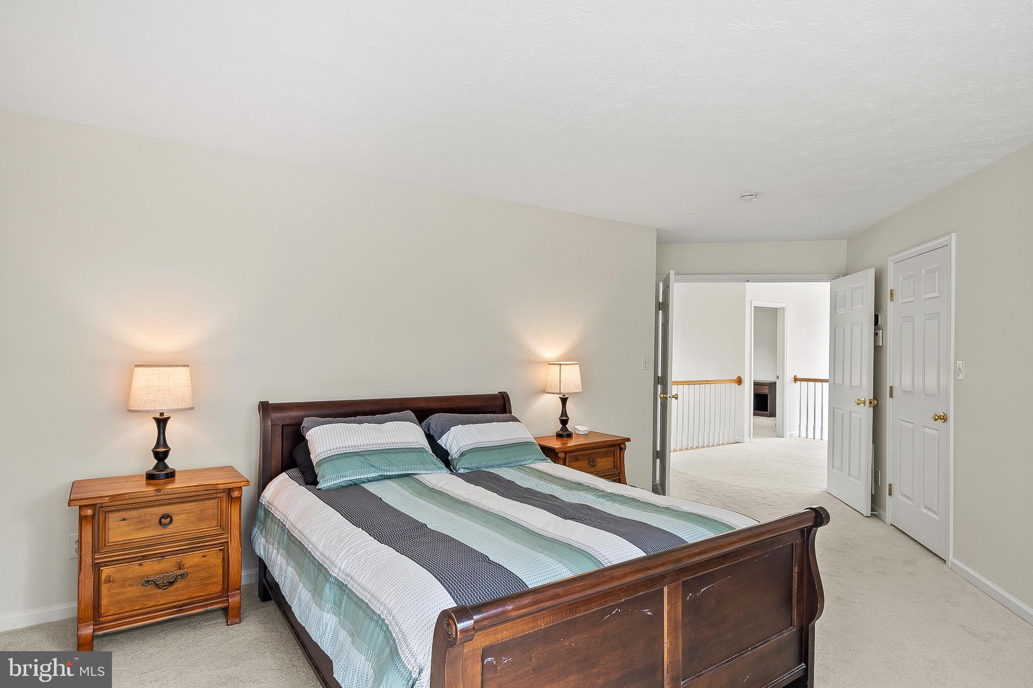 456 North Patuxent Road Odenton, MD 21113 - Photo 21 of 44 a bedroom with a bed and a night stand