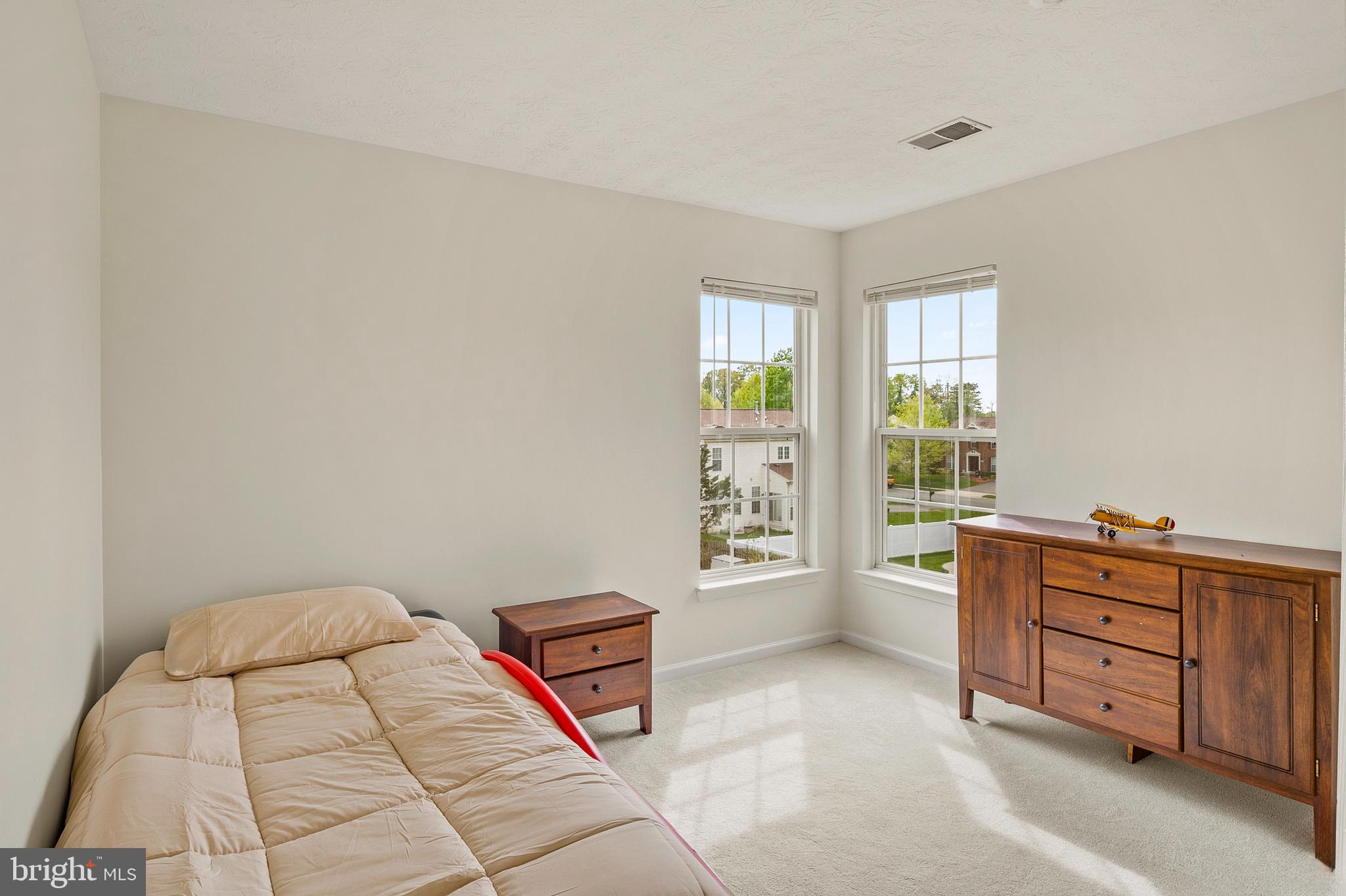 456 North Patuxent Road Odenton, MD 21113 - Photo 26 of 44 a bedroom with a bed and a window