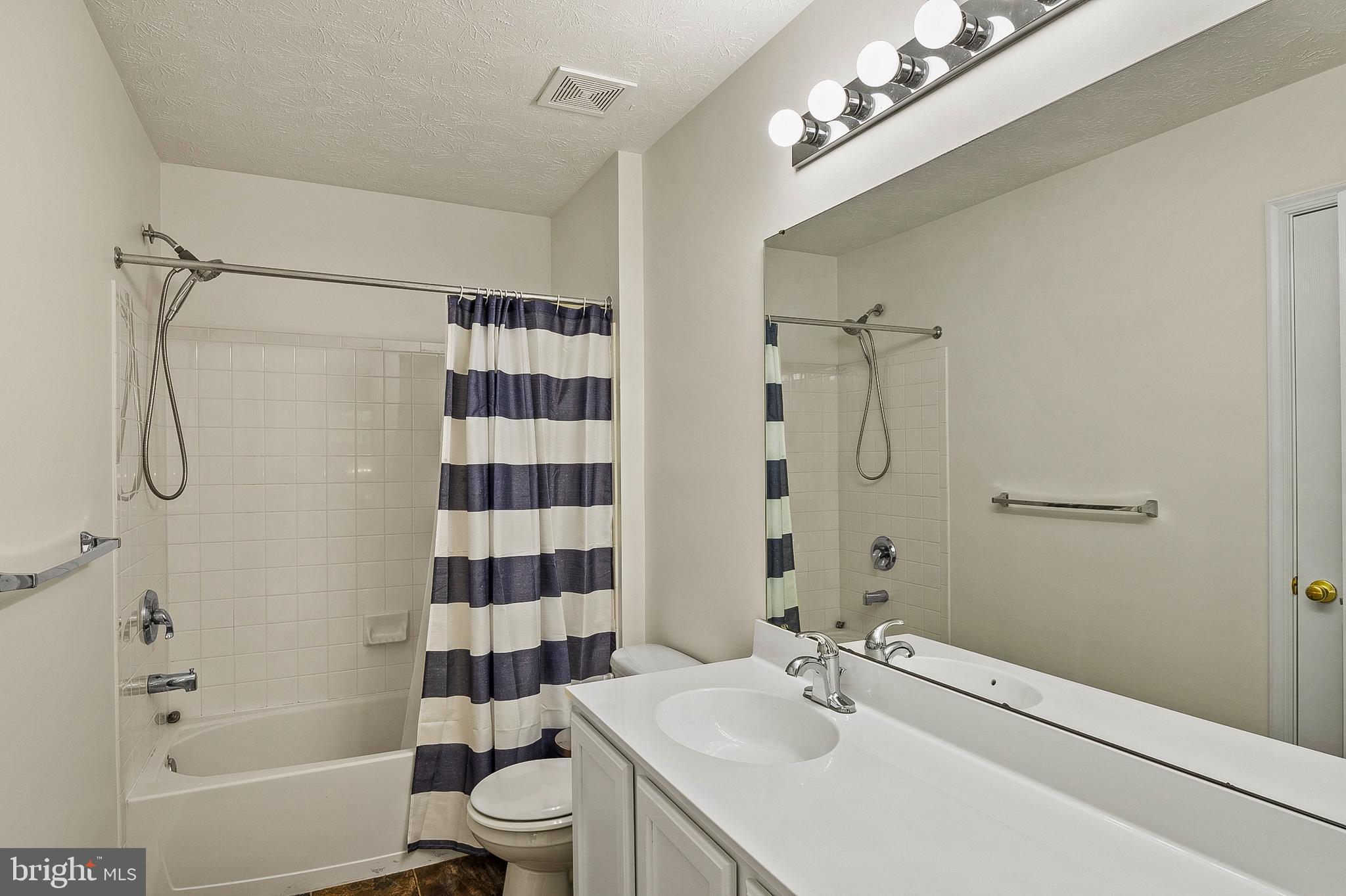 456 North Patuxent Road Odenton, MD 21113 - Photo 27 of 44 a bathroom with a sink a toilet a shower and a mirror